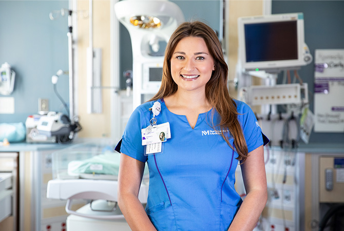 Emma Joy, nurse, posing at Northwestern Memorial Hospital room