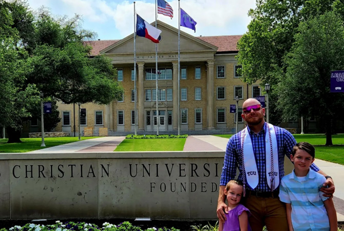 Arrow pictured with his children, Mason and Aila on his graduation day.