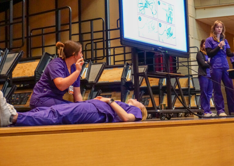 TCU Nursing students demonstrate how to properly administer Naloxone, an opioid overdose reversal medication. This training for local school nurses and police officers is part of a service-learning course.