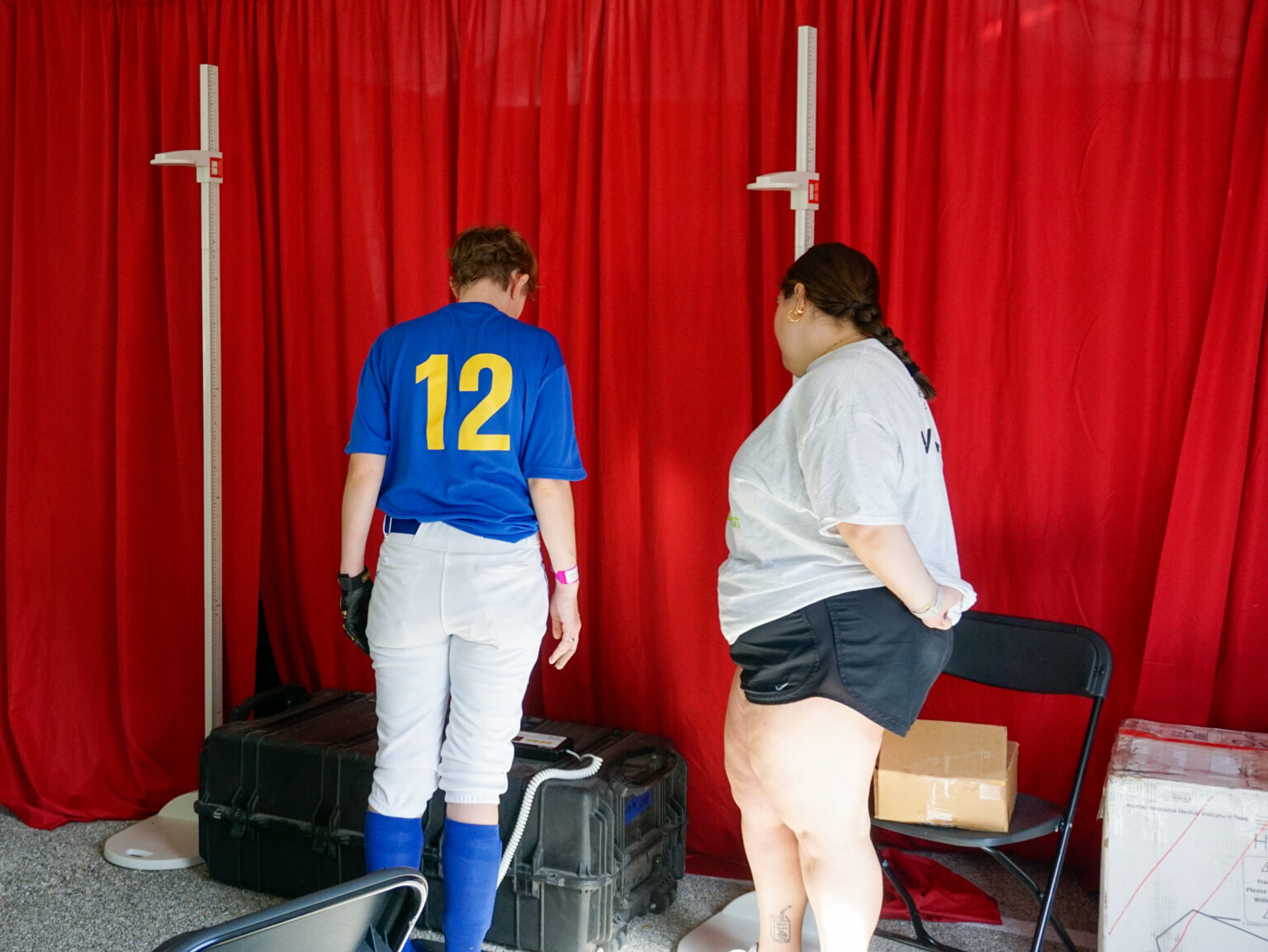 Special Olympic athlete getting a health screen provided by tcu student